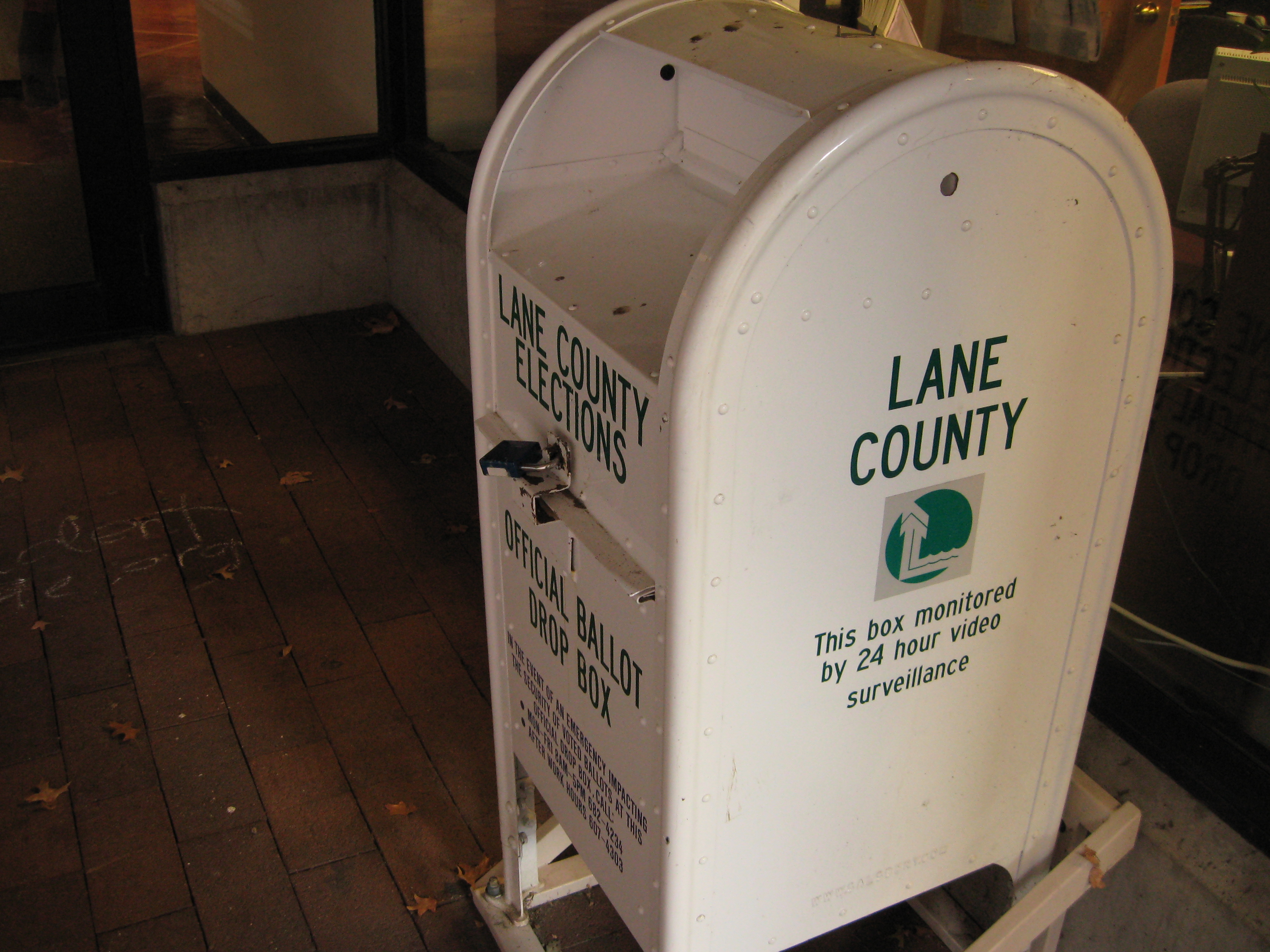 A box looks like a U.S. mailbox except it's painted white and has
prominent lock.